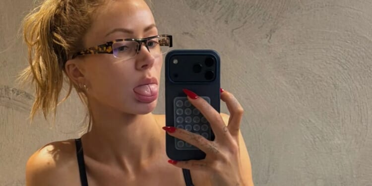 Olivia Attwood kneels down in plunging bra and leggings as she 'pays bikini tax' before getting glammed up for BRITs