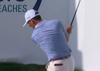 Golf star in furious row with fan after being heckled as security forced to step in and kick supporter out