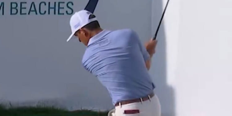 Golf star in furious row with fan after being heckled as security forced to step in and kick supporter out