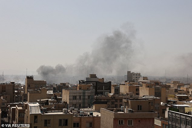 Smoke rises following an explosion after the US and Israel launched strikes on Iran