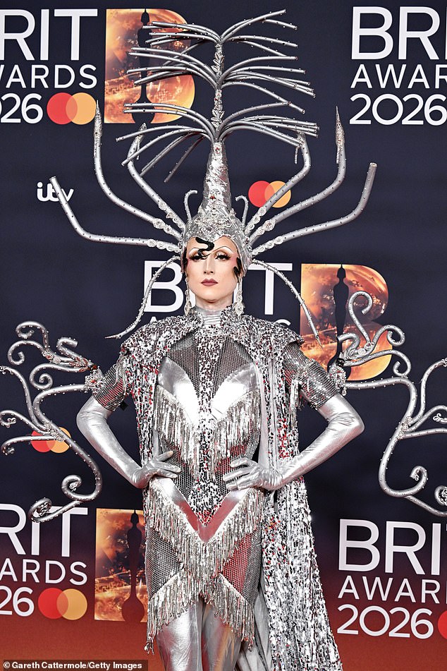 Marmalade's extravagant silver tasseled dress featured a bizarre headpiece that consisted of sequined branches