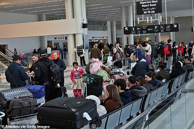 Passengers stranded at the Rafik Hairiri International Airport in Beirut, Lebanon, on Saturday after the missile attacks