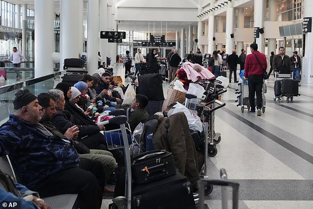 Passengers stranded at Rafik Hariri International Airport in Beirut, Lebanon, on Saturday after the missile strikes
