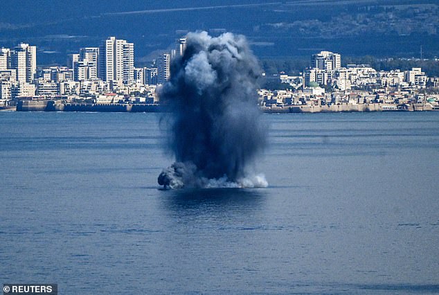 An explosion is seen off the coast of Haifa in northern Israel Saturday as Iran retaliated against a joint US-Israel operation that took place Saturday morning