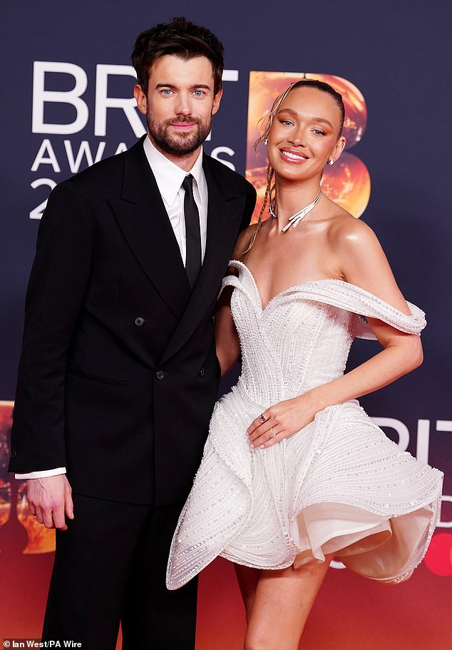 The Bad Education star rocked a smart with black tie as he cosied up to the leggy model, who put on a show-stopping display in a coquette mini dress