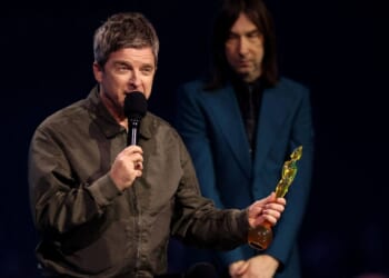 Noel Gallagher is BOOED at the Brits just seconds after picking up prestigious award