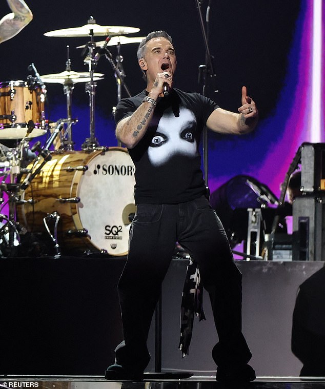 Robbie was then introduced to the stage as he fronted supergroup alongside Adam Wakeman, Robert Trujillo, Tommy Clufetos and Zakk Wylde for one night only