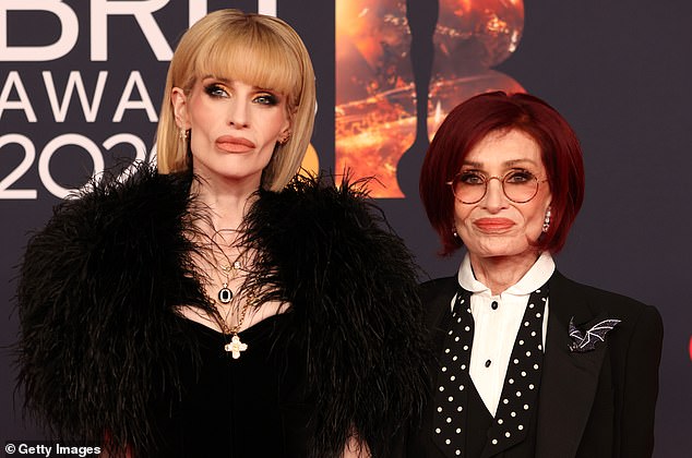 Sharon showed off a bat shaped broach on her lapel saying: 'It's a pin [he] always wore' while Kelly wore a crucifix which was also owned by Ozzy