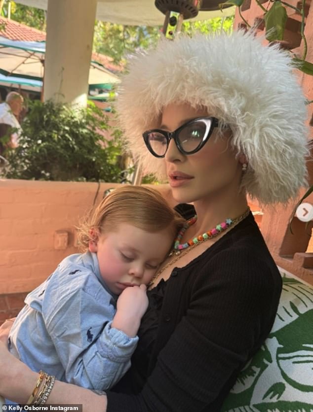 Kelly pictured with her son and Sharon's grandson Sidney