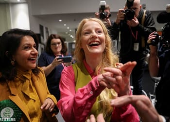 Green Party's candidate Hannah Spencer reacts during vote counting in the Gorton and Denton by-election