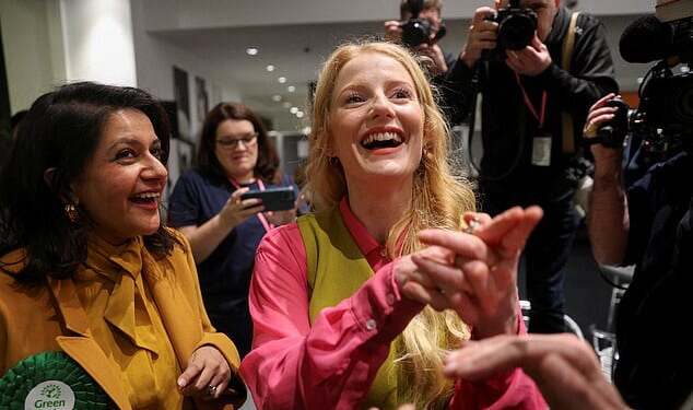 Green Party's candidate Hannah Spencer reacts during vote counting in the Gorton and Denton by-election