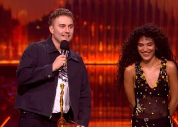 Olivia Dean won the first award of the night at the BRIT Awards on Saturday when she took home the gong for Song Of The Year for Rein Me In with Sam Fender