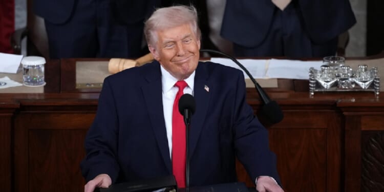 President Donald Trump grins while delivering his State of the Union address Tuesday in the Capitol.
