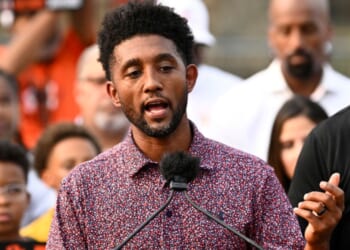 Baltimore Mayor Brandon Scott, left, speaks during a Sept. 5 news conference.