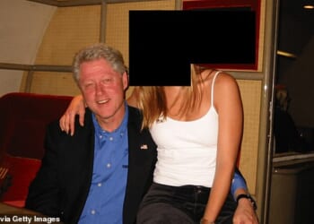 Bill Clinton with his arm around a young woman on a private jet in a photo from the Epstein files
