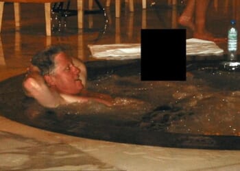 Former President Bill Clinton in a hot tub and a woman whose face has been redacted are seen in another image from the files tied to convicted sex offender Jeffrey Epstein