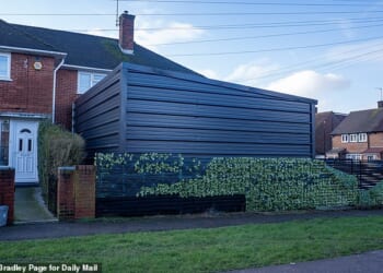 Pictured: The giant fortress-like metal garage, which stands 3.4 metres high and more than seven metres wide