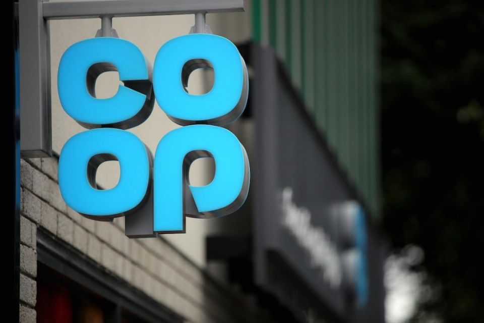 Blue Co-op sign mounted outside a building.