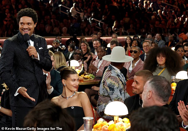 Earlier Bieber shot his wife Hailey a look as Trevor Noah stood by them