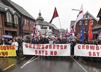 Protesters march through Crowborough on February 1, 2026, to voice their anger at asylum seekers being housed at a nearby army camp