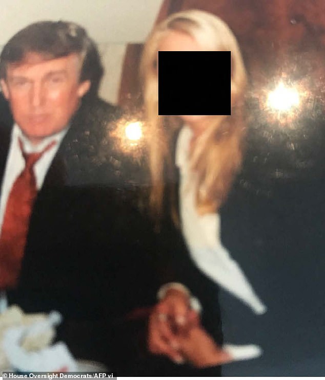 The woman claimed she was forced into a sex act with Trump when she was about 13 or 14 years old in New Jersey. Trump is pictured here with an unidentified woman in a photo released by Democrats on the House Oversight Committee