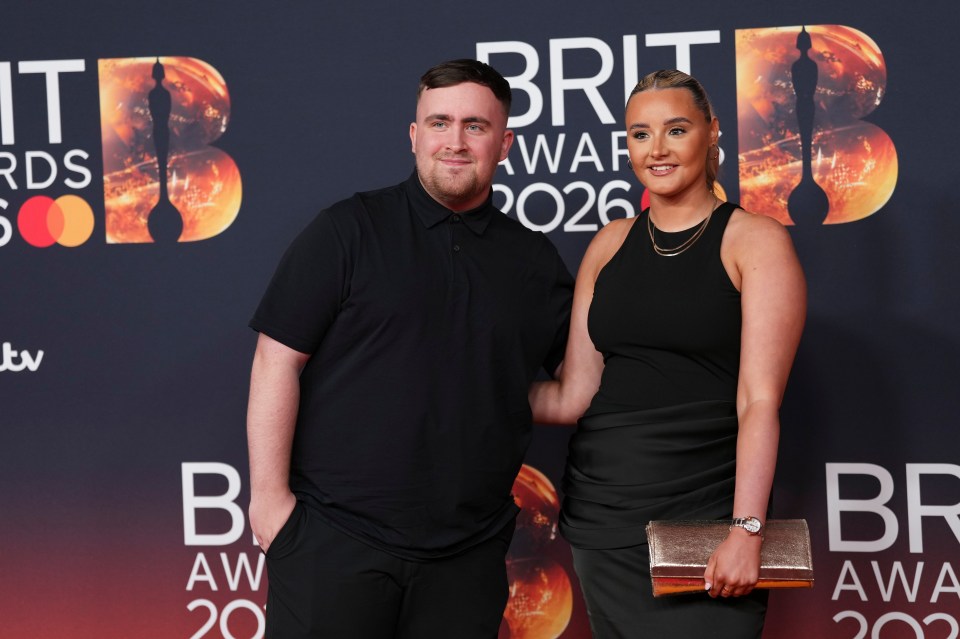 Luke Littler and Faith Millar posing for photographers on the red carpet at the Brit Awards 2026.