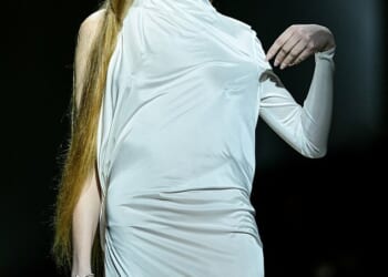 Elon Musk's transgender daughter Vivian Wilson slipped into a silky gown as she took to the catwalk at Milan Fashion Week