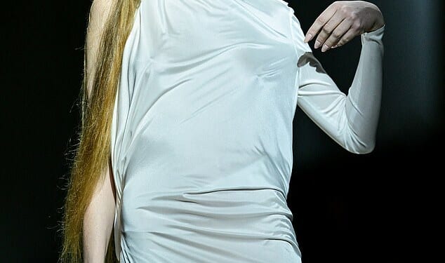 Elon Musk's transgender daughter Vivian Wilson slipped into a silky gown as she took to the catwalk at Milan Fashion Week