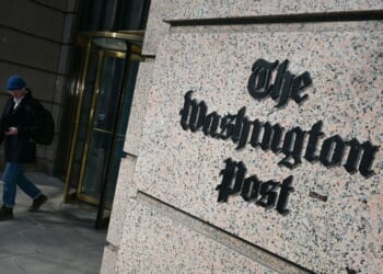 A man exits the Washington Post office building in Washington, D.C., in a file photo dated Feb. 4.