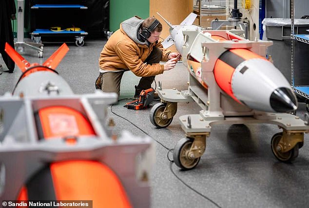 A worker prepares the B61-13, a nuclear 'gravity bomb' being produced by the US that is 24 times more powerful than the atom bomb dropped on Hiroshima, Japan in 1945
