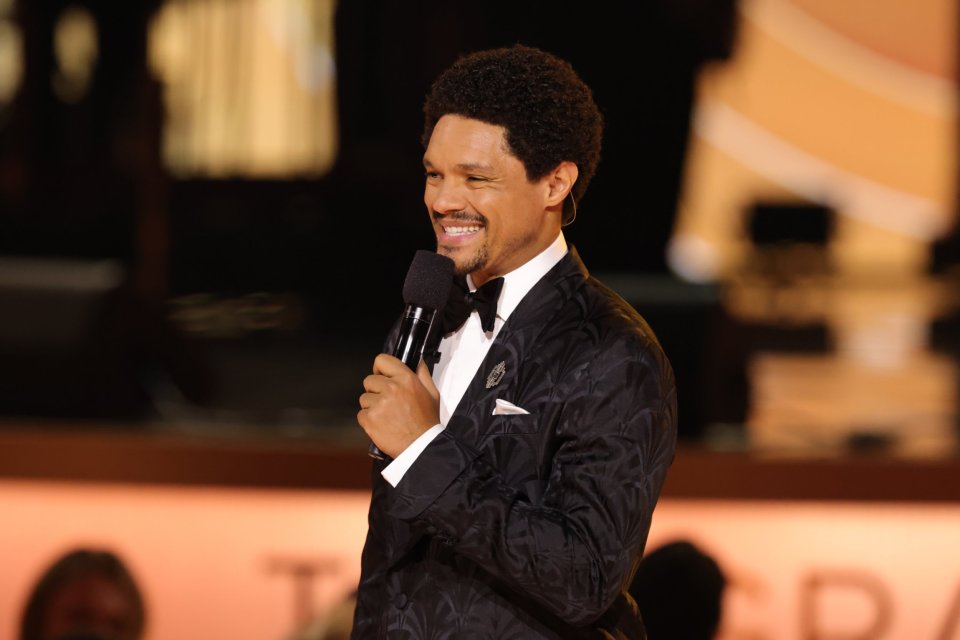 Trevor Noah speaking onstage at the 68th GRAMMY Awards.