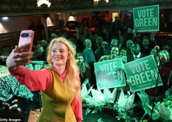 Hannah Spencer celebrates with Green Party supporters after her by-election victory