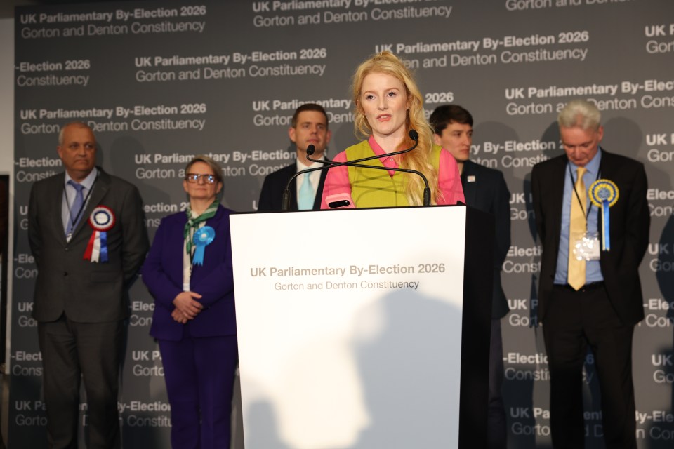 Green Party candidate Hannah Spencer speaking at a podium after winning the Gorton and Denton By-Election.