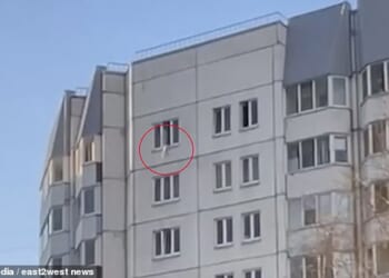 A Russian toddler survived a 110ft fall from a tower block window after two women used a coat to catch him mid-air