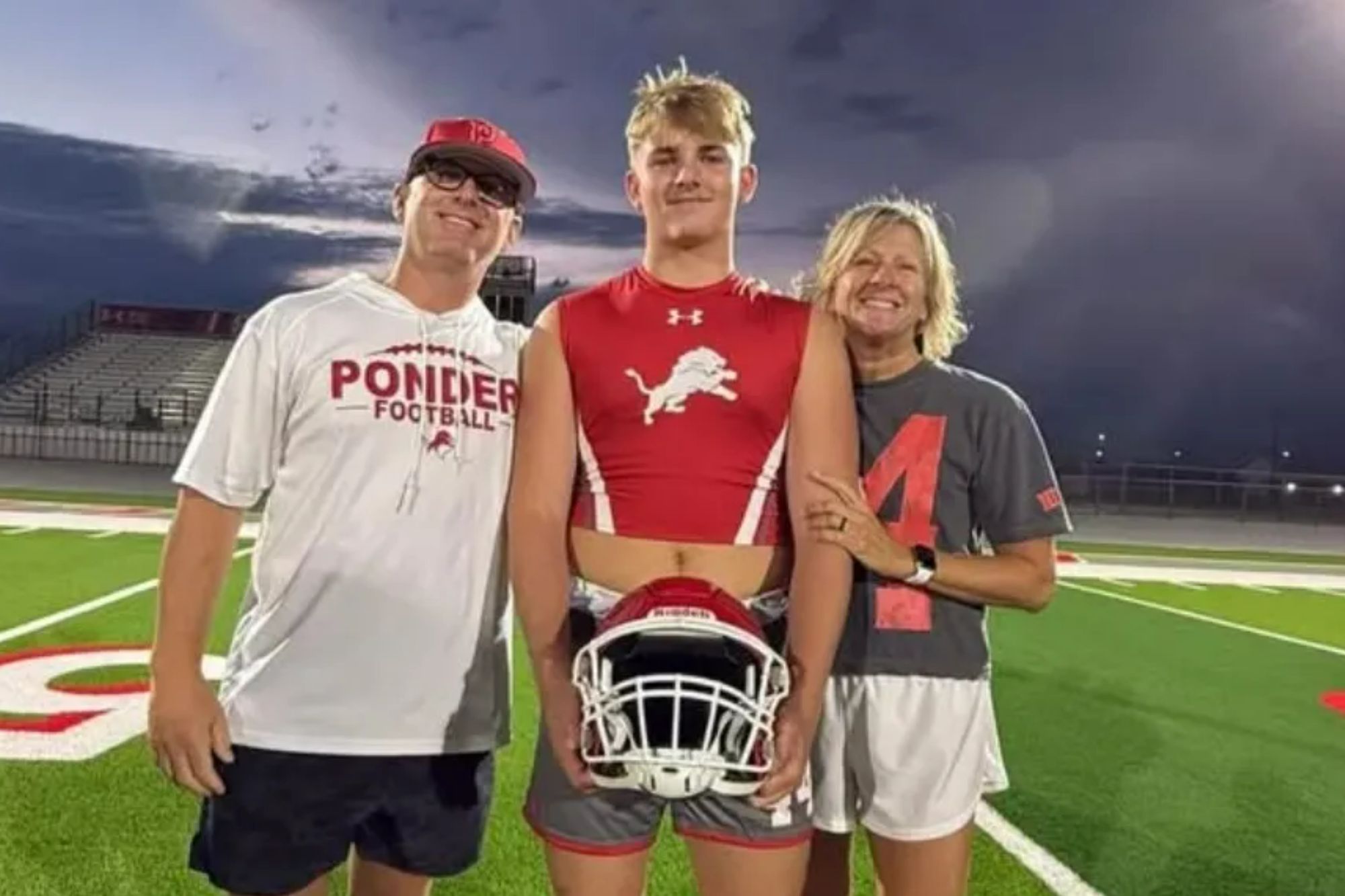 An image collage containing 1 images, Image 1 shows A young man in a red football jersey stands with his parents on a football field