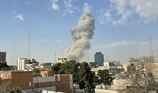 An image shows smoke billowing from a building after an explosion in Tehran, Iran, on Saturday morning. The apparent strike happened near the offices of Supreme Leader Ayatollah Ali Khamenei