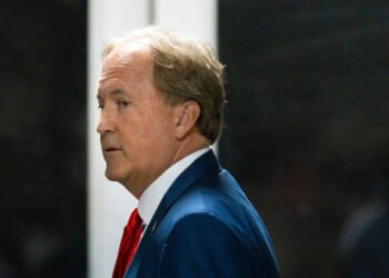 Texas Attorney General Ken Paxton arrives with President Donald Trump to court during Trump's trial for allegedly covering up hush money payments at Manhattan Criminal Court on April 30, 2024, in New York City.
