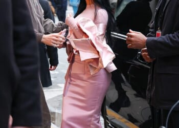 Kim Kardashian turned heads as she arrived in Paris on Monday, after her romantic weekend getaway in the Cotswolds with Lewis Hamilton