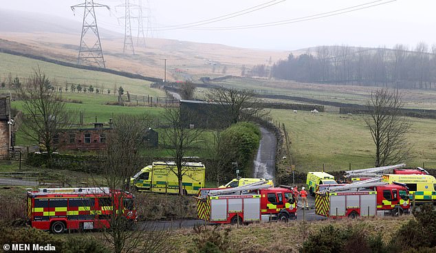 A light aircraft with two people on board has crashed near a lake next to the M62 in Greater Manchester