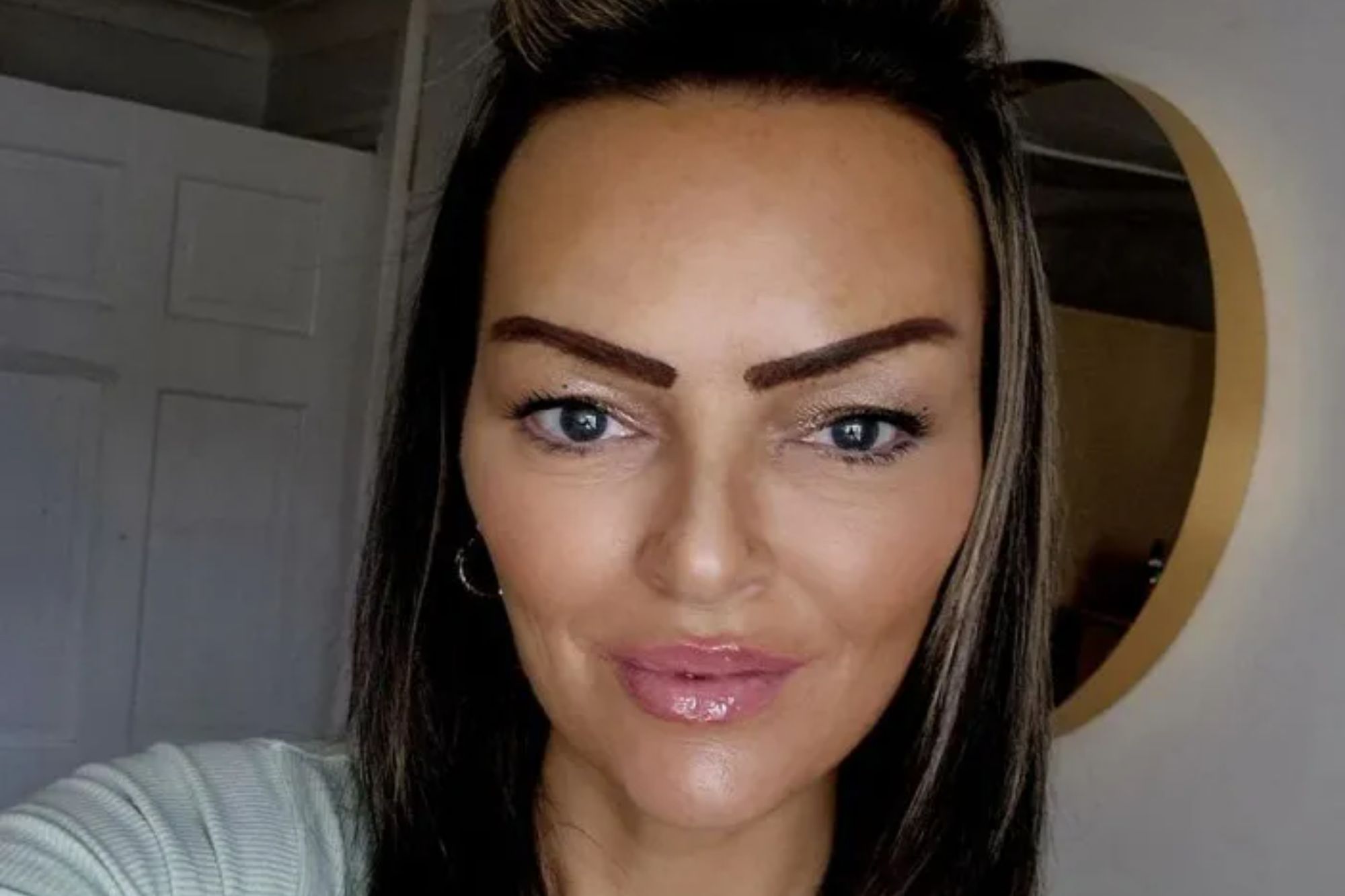 An image collage containing 1 images, Image 1 shows A woman with dark hair and blue eyes smiles at the camera