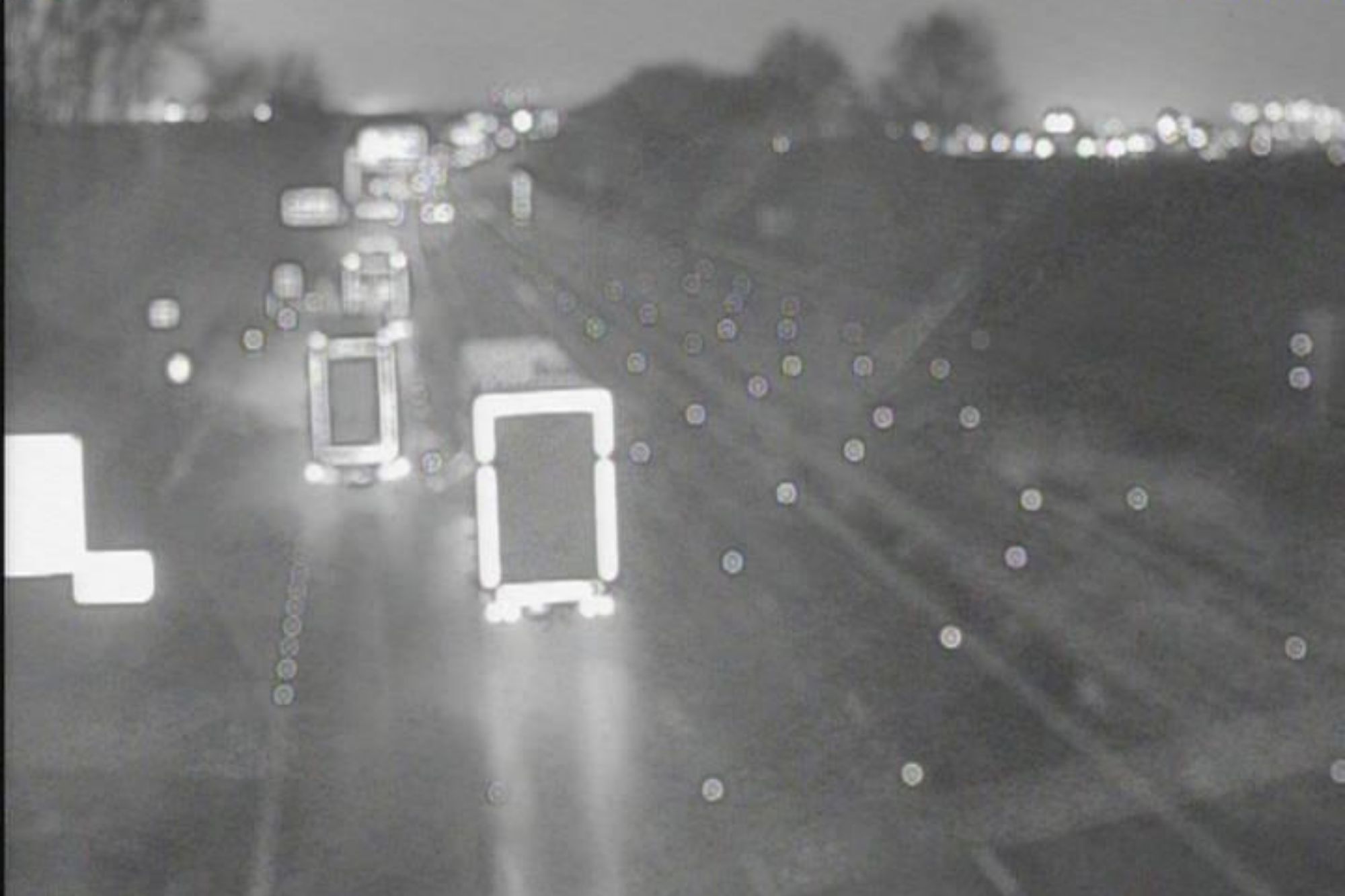 An image collage containing 1 images, Image 1 shows Monochrome image of nighttime highway traffic with blurred lights