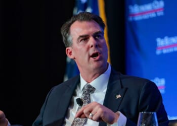 Oklahoma Gov. Kevin Stitt is interviewed by David Rubenstein alongside Maryland Gov. Wes Moore at the Economic Club on Feb. 18, 2026, in Washington, D.C.