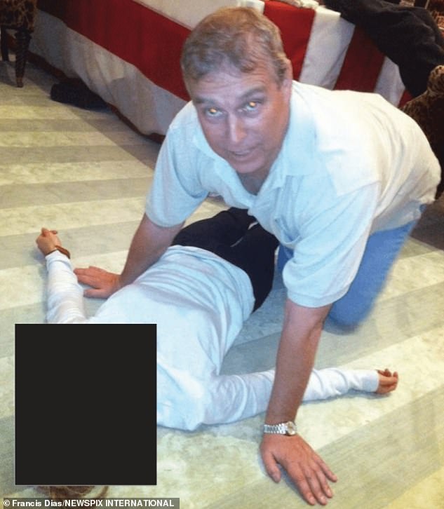 Among the new files were images of Andrew kneeling over an unidentified woman