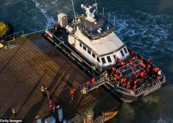 Migrants disembark from a Border Force boat at Ramsgate Port in Kent this week