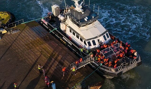 Migrants disembark from a Border Force boat at Ramsgate Port in Kent this week