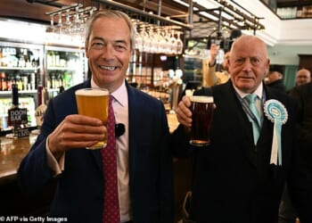 Reform leader Nigel Farage, pictured with candidate Trevor Shonk, has previously said: 'This is a death knell for country pubs across Britain. Labour has no connection to how real life works'