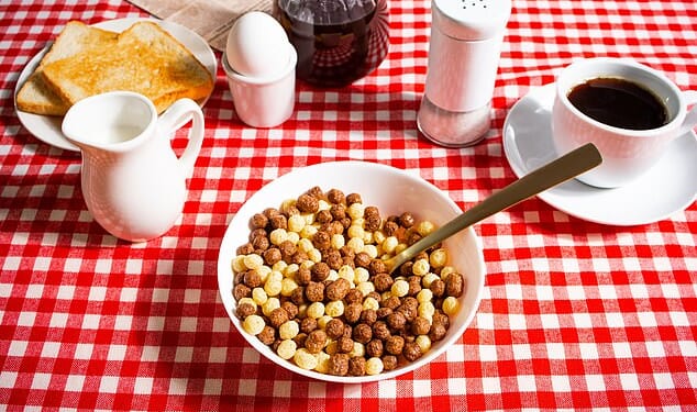 If you like a cup of coffee with your morning cereal, you might be blocking most of the nutrients in your breakfast  (stock image)
