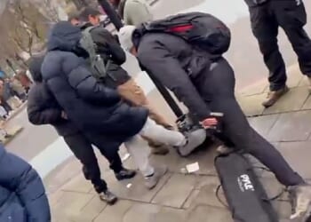 Footage shows the moment a Christian preacher's equipment is kicked in Whitechapel