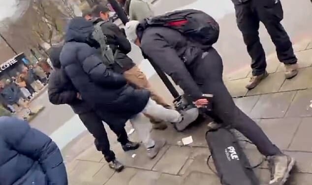 Footage shows the moment a Christian preacher's equipment is kicked in Whitechapel