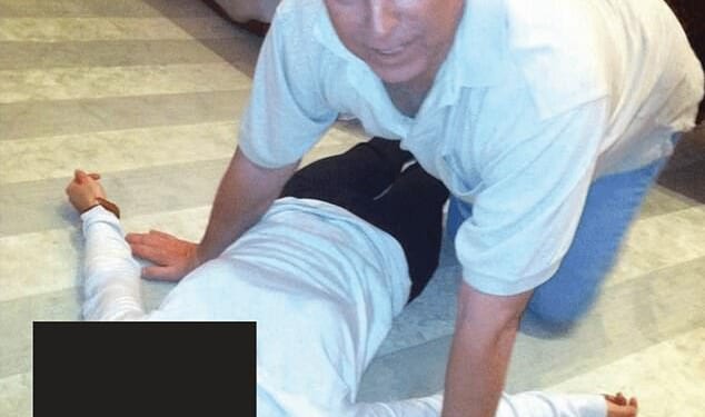 Andrew Mountbatten-Windsor crouched over an unidentified woman which has been released in the latest disclosure of files linked to Jeffrey Epstein